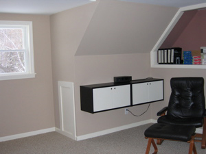 a built-in cabinet and storage nook in office/recreation/family room